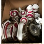 A box containing an Old Royal China part tea service with puce and floral decoration and a small