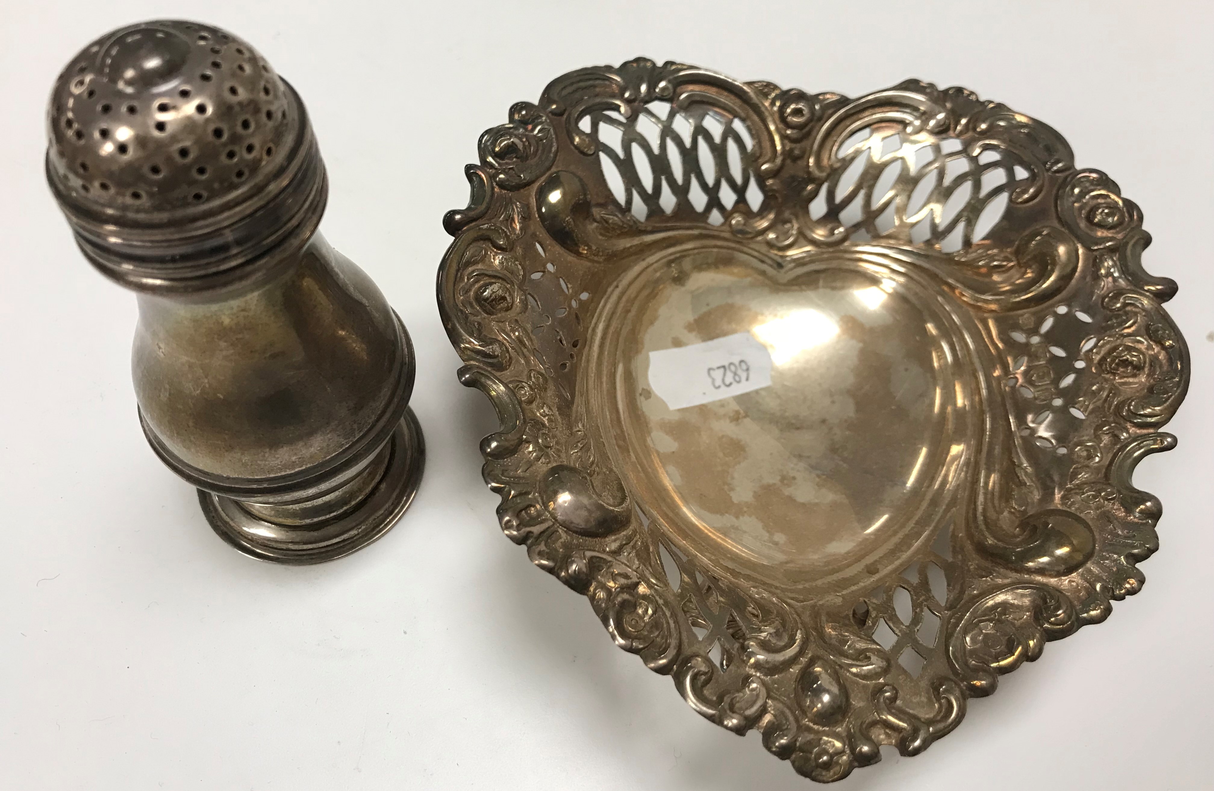 A Victorian silver bonbon dish of love heart form with pierced and embossed decoration,