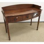 An early 19th Century mahogany washstand of bow fronted form,