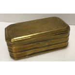 A 19th Century Dutch brass tobacco box of rectangular form with canted corners,