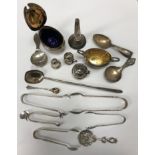 A collection of silver wares to include a miniature Guernsey creamer,