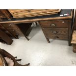 A mid 20th Century oak double pedestal desk,