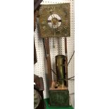 A 20th Century brass water clock in the 17th Century style with brass square dial and Roman