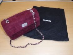 A Chanel raspberry suede square quilted handbag,