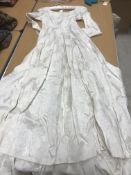 A mid 20th Century floral self patterned wedding dress with under skirt
