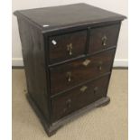 An 18th Century elm chest of drawers, the plain top above two short over two long drawers,