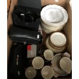 A box containing various binoculars,