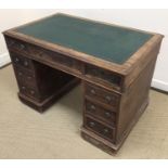 A Victorian mahogany double pedestal desk, the plain top with leather insert top over three drawers,