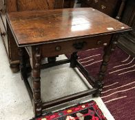 An oak side table in the 17th Century style, the plain top above a single drawer,
