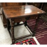 An oak side table in the 17th Century style, the plain top above a single drawer,