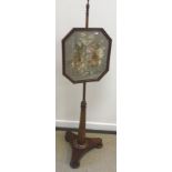 A Victorian mahogany pole screen with silkwork floral decorated panel,