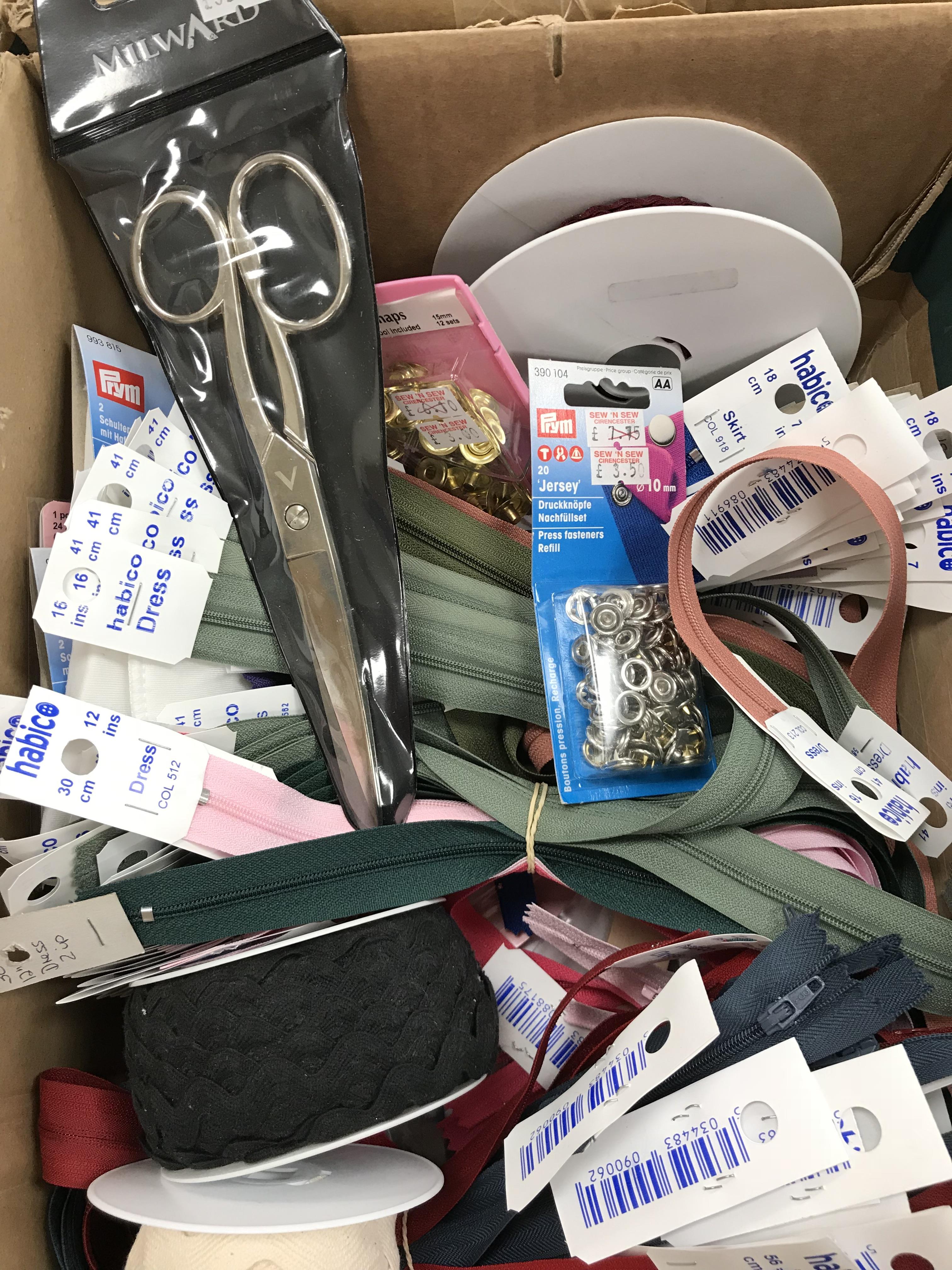 A box containing a large quantity of unused sewing haberdashery to include interalia, scissors,