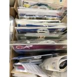 A box containing unused cross-stitch kits (19),