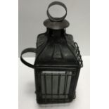 A 17th Century iron and treenware rush light holder 26 cm high,