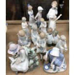A collection of fourteen various Nao by Lladro figures various, tallest 21 cm,