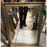 A collection of modern wall mirrors, various sizes and frames,