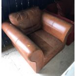 A modern brown leather upholstered scroll arm chair 104 cm wide x 95 cm deep x 72 cm high and