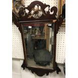 A 19th Century wall mirror with pierced ho ho style bird decoration to top,