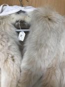 A collection of furs to include a mink jacket with three quarter length sleeves and satin lining,