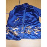 A set of vintage Chinese silk pyjamas in blue and gold, comprising trousers and tank top,