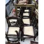 A set of five Victorian bar back dining chairs, raised on fluted front legs,