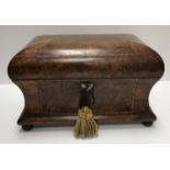 An early 19th Century walnut and parquetry inlaid tea caddy,
