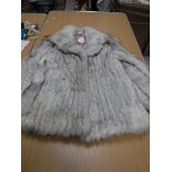 A Norwegian blue fox fur coat with sateen lining,