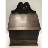 An 18th Century oak candle box,