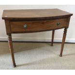 A 19th Century mahogany single drawer bow fronted side table on turned legs 92 cm wide x 51.