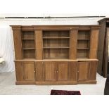 A 20th Century oak breakfront dresser in the Arts & Crafts manner,