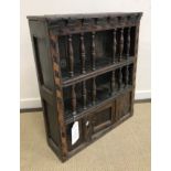 A 17th Century oak food cupboard with bog oak and holly parquetry work barber pole banding,