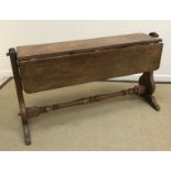 A 19th Century mahogany ship's drop-leaf table with brass mounts,