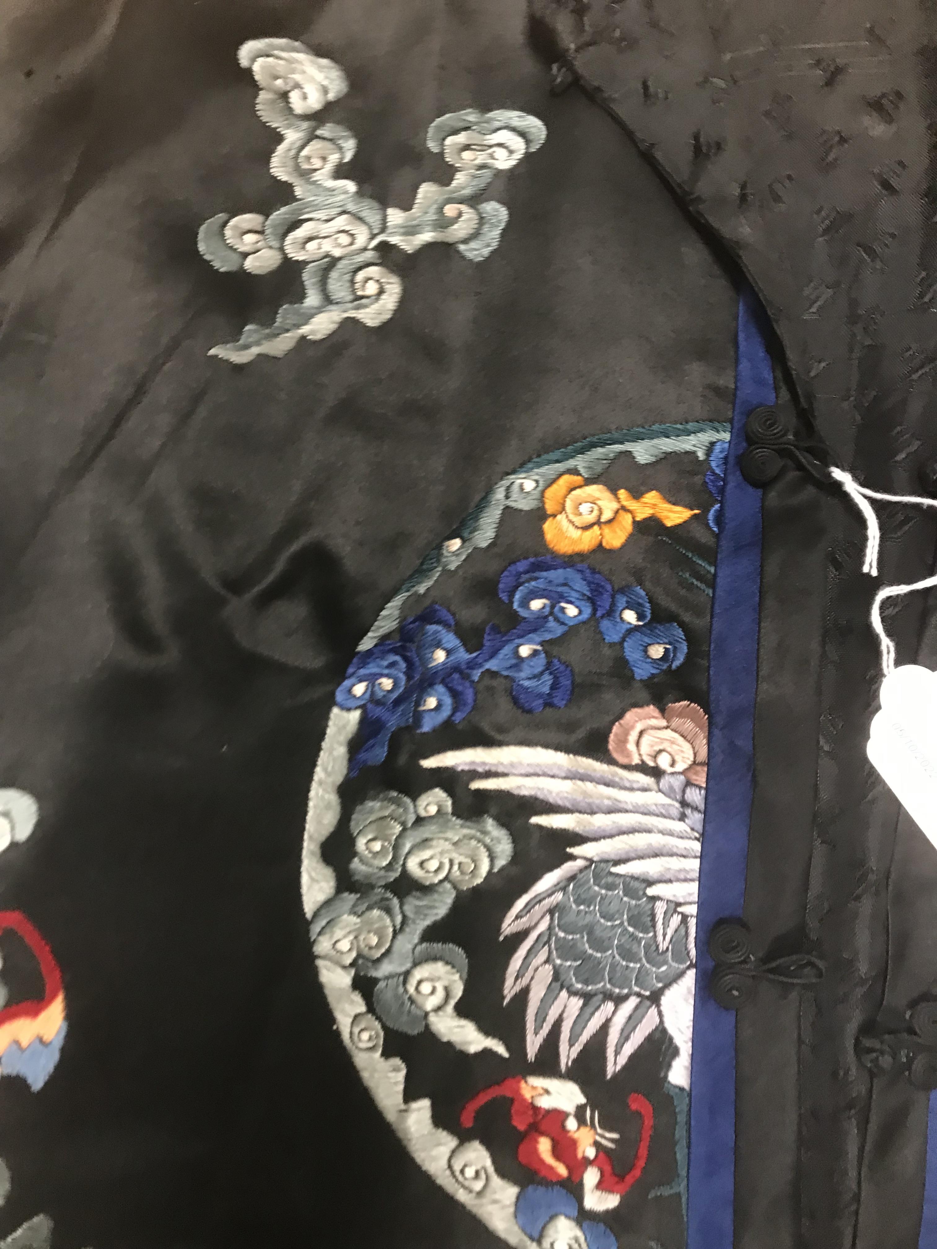 A Chinese silk jacket with crane and wave decoration on a black ground - Image 3 of 8