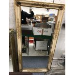 A modern rectangular gilt framed mirror,