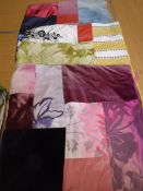 A collection of seven patchwork scatter cushion covers in different colourways,