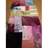 A collection of seven patchwork scatter cushion covers in different colourways,