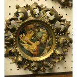 A set of three late 19th / early 20th Century carved giltwood and gesso circular picture frames in