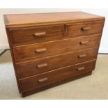 A post war teak chest of two short over three long graduated drawers with lug handles,