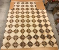A 19th Century saw tooth and star pattern patchwork quilt (possible for a four poster bed) in cream