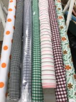 Seven rolls and part rolls of polycotton patterned fabric together with six full and part rolls of