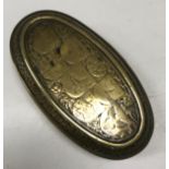 An 18th Century Dutch brass oval tobacco box with all over scrolling foliate decoration,