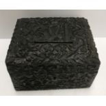 A circa 1900 Irish carved bog oak box, the lid decorated with crown,