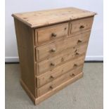 A modern pine chest of two short over four long graduated drawers,