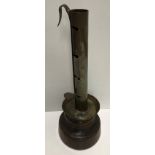An 18th Century brass and treenware adjustable candle holder 27 cm high