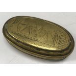 An 18th Century Dutch brass tobacco box of oval form,