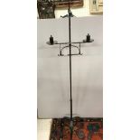 A wrought iron candle stand in the 17th Century manner,