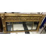 A 19th Century giltwood and gesso triple plate overmantle wall mirror with scrolling foliate and