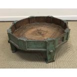 A 20th century Indian painted teak fruit press of octagonal form on 4 tapered supports 75.