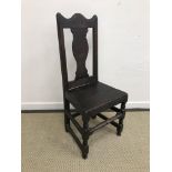 An oak moulded slat back and panel seated hall chair in the 17th Century Flemish taste,