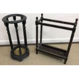 A Victorian ebonised stick stand of circular form, with turned and ringed supports,